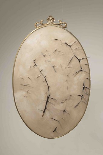 Silvia Giambrone, Mirrors, 2018, brass, resin, wax, thorny acacia. 100×65 cm. Courtesy of the artist An oval artwork with gold frame, beige texture, and dark thorns protruding across the surface.